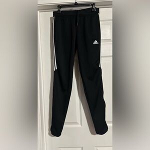 Adidas unisex Black Joggers with White Stripes are a size medium.